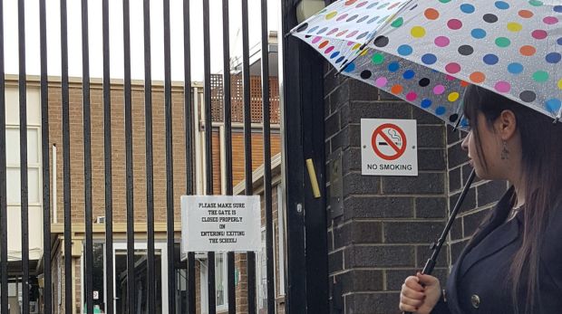 Dassi Erlich at the gates of the Adass Israel school in Elsternwick. Photo: Supplied